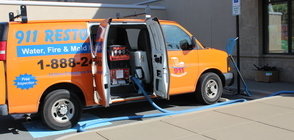 Water Damage and Mold Removal Van At Job Site