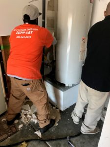 water damage restoration water heater wall